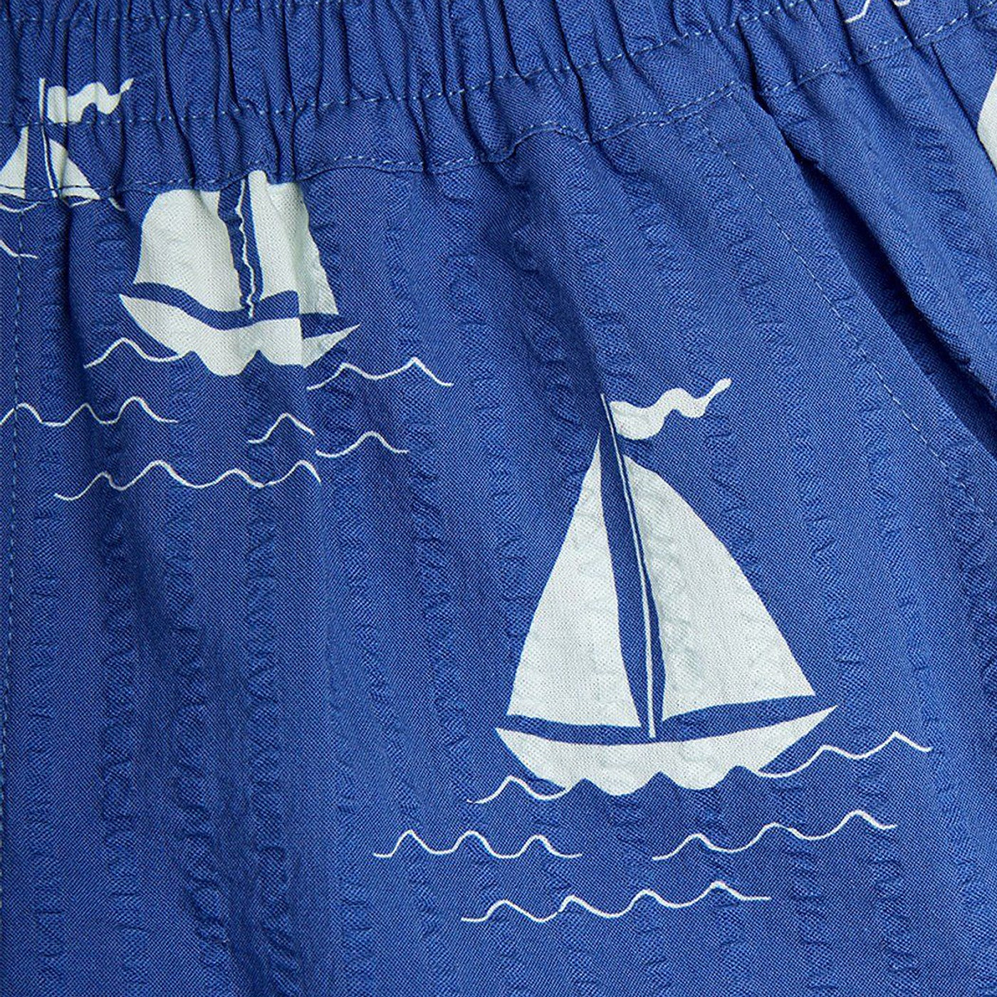 Blue shorts with sailboats