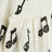 White bodysuit with musical notes
