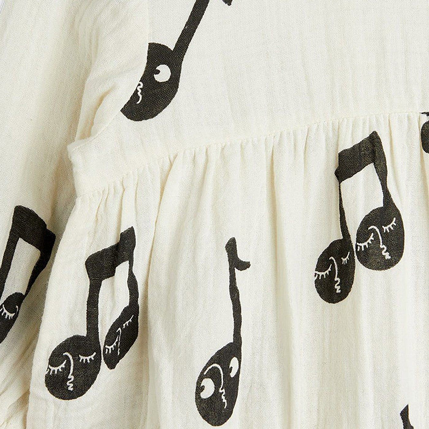 White bodysuit with musical notes