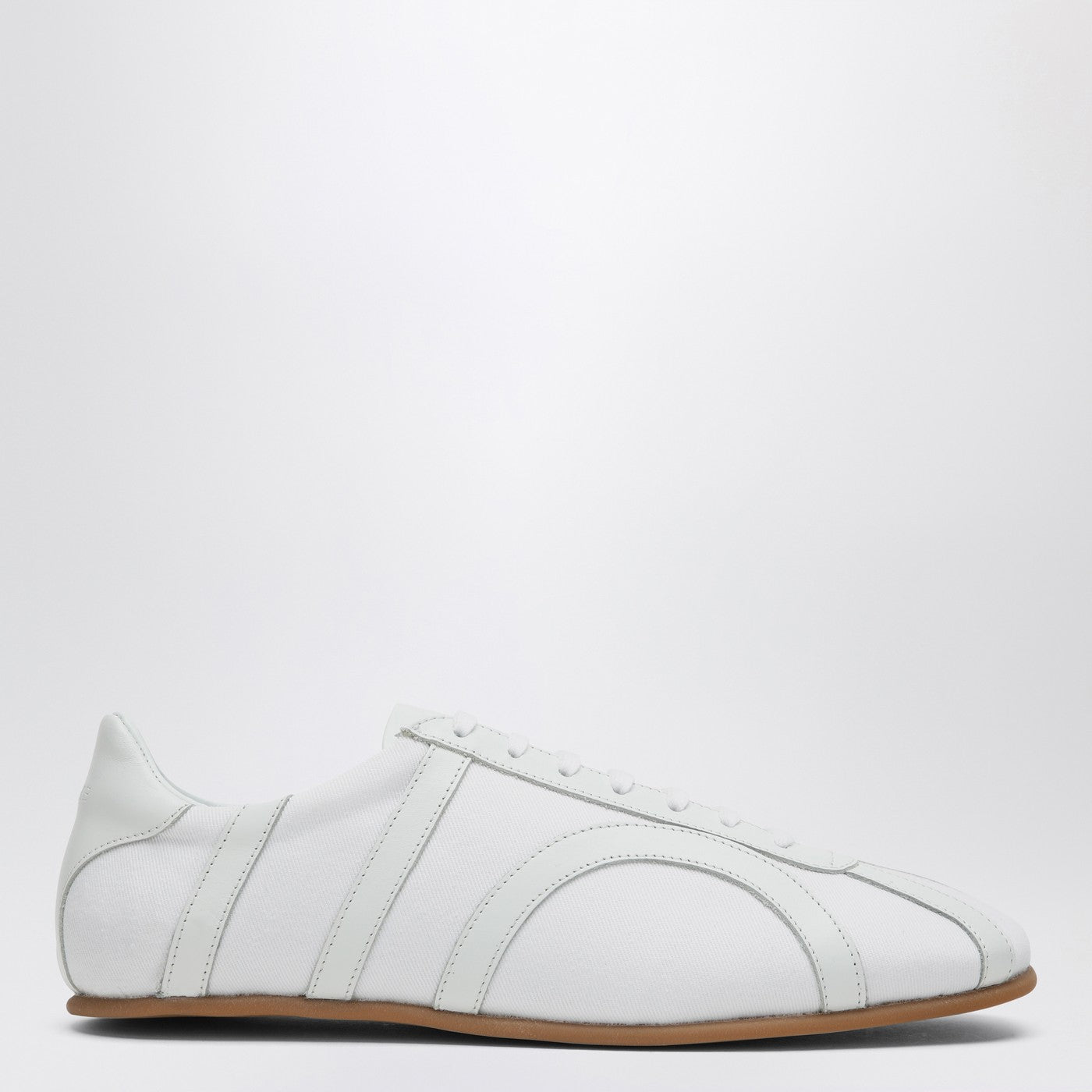 White textile materials and leather sneaker