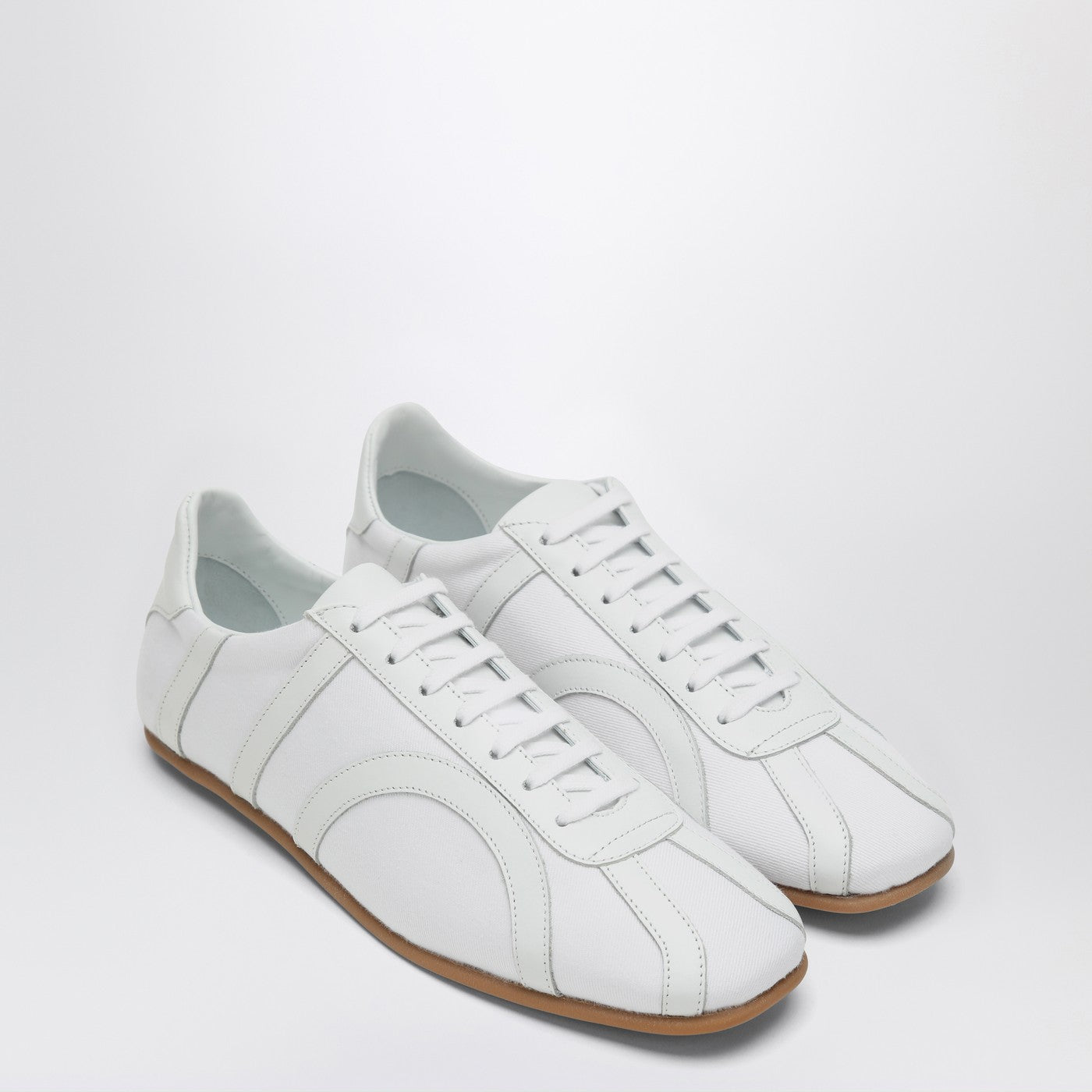 White textile materials and leather sneaker
