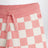 Pantaloni a scacchi rosa in cotone biologico