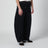 Pantalon noir en coton mélangé à jambe courbe