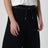 Pantalon noir en coton mélangé à jambe courbe