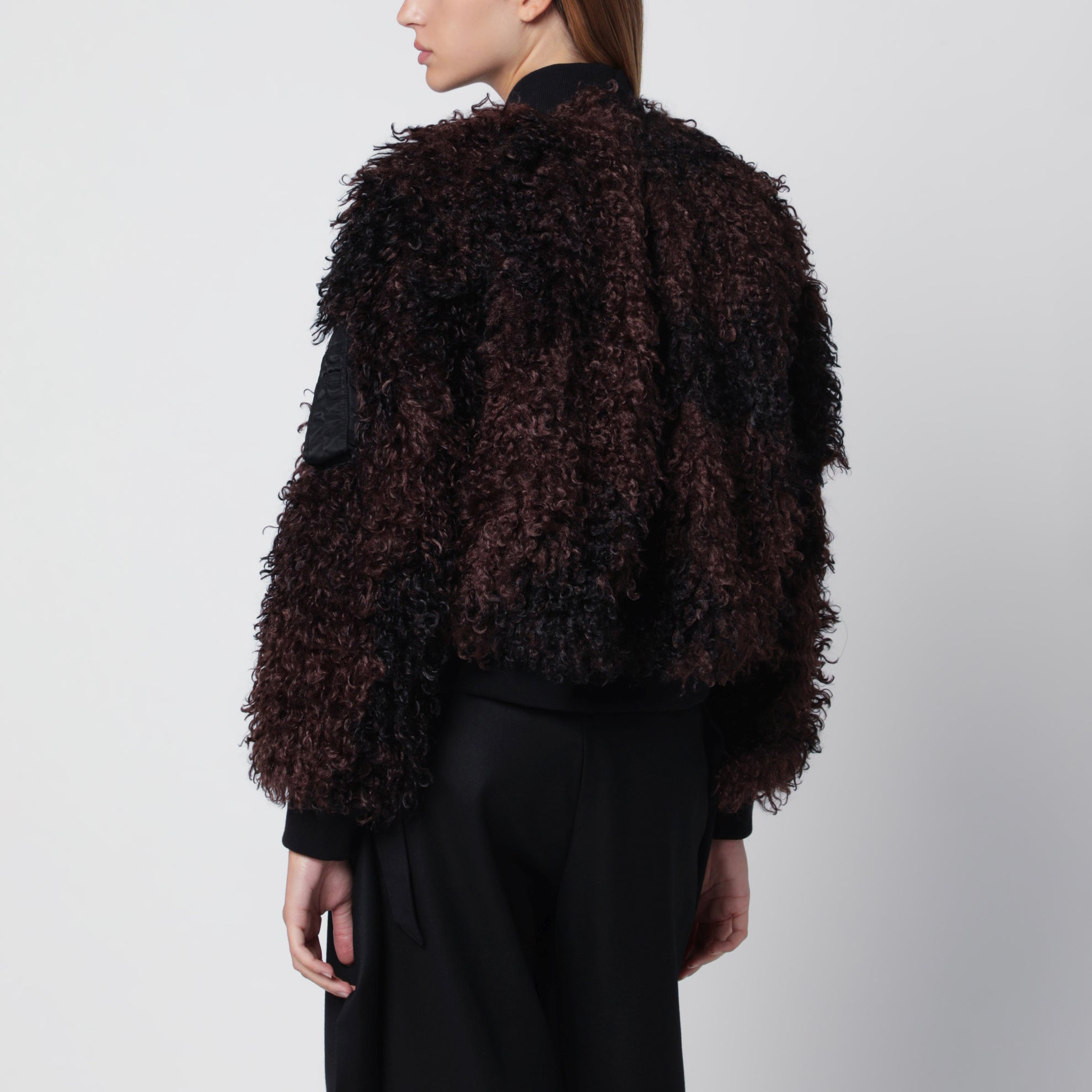 Bomber jacket with curly-effect faux fur inserts