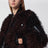 Bomber jacket with curly-effect faux fur inserts