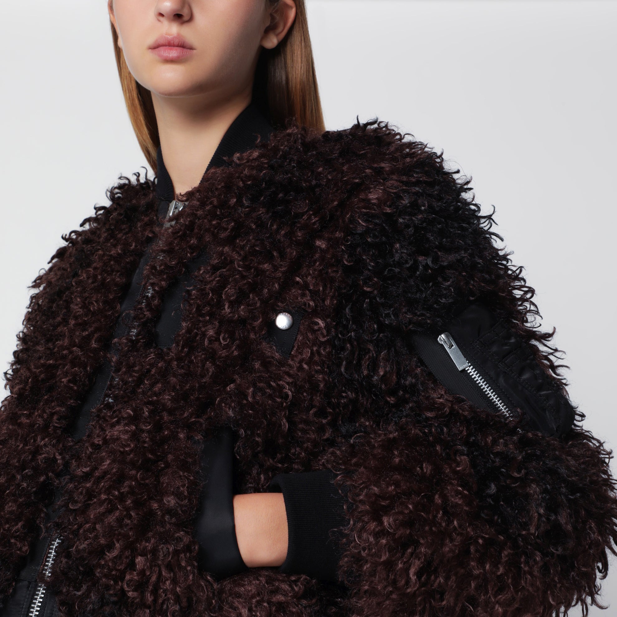 Bomber jacket with curly-effect faux fur inserts