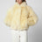 Pelliccia corta con cappuccio beige lemon