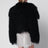 Cropped Bomberjacke aus schwarzem Curly-Shearling-Lammfell