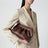 Tia clutch in brown