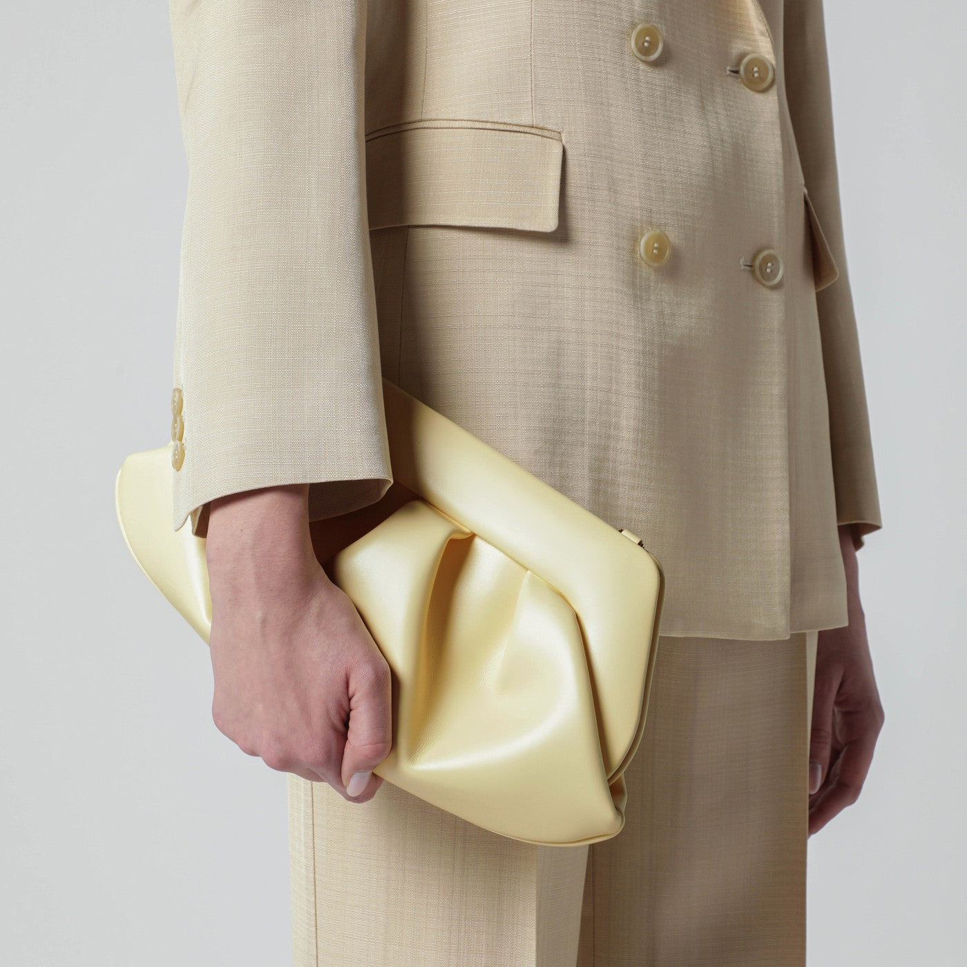 Emera clutch in pastel yellow