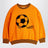 Orange sweatshirt with chenille soccer ball
