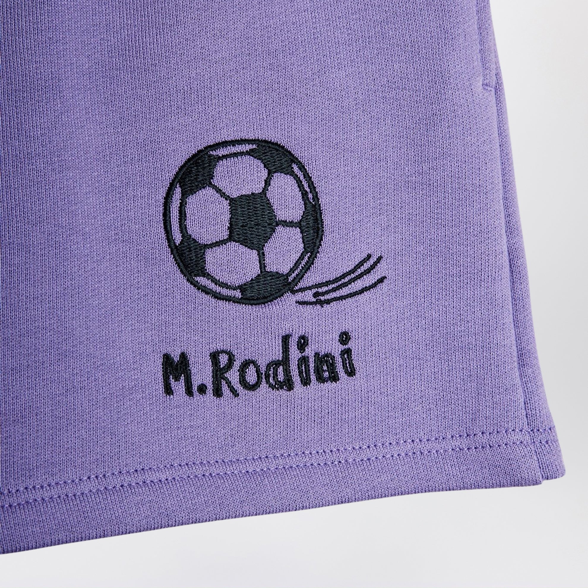 Purple shorts with soccer ball embroidery