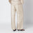 Elfenbeinfarbene Seidenhose mit Monogramm