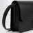 Pochette en cuir noir avec fermeture à cadenas en T