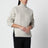 Ecru cable-knit wool turtleneck