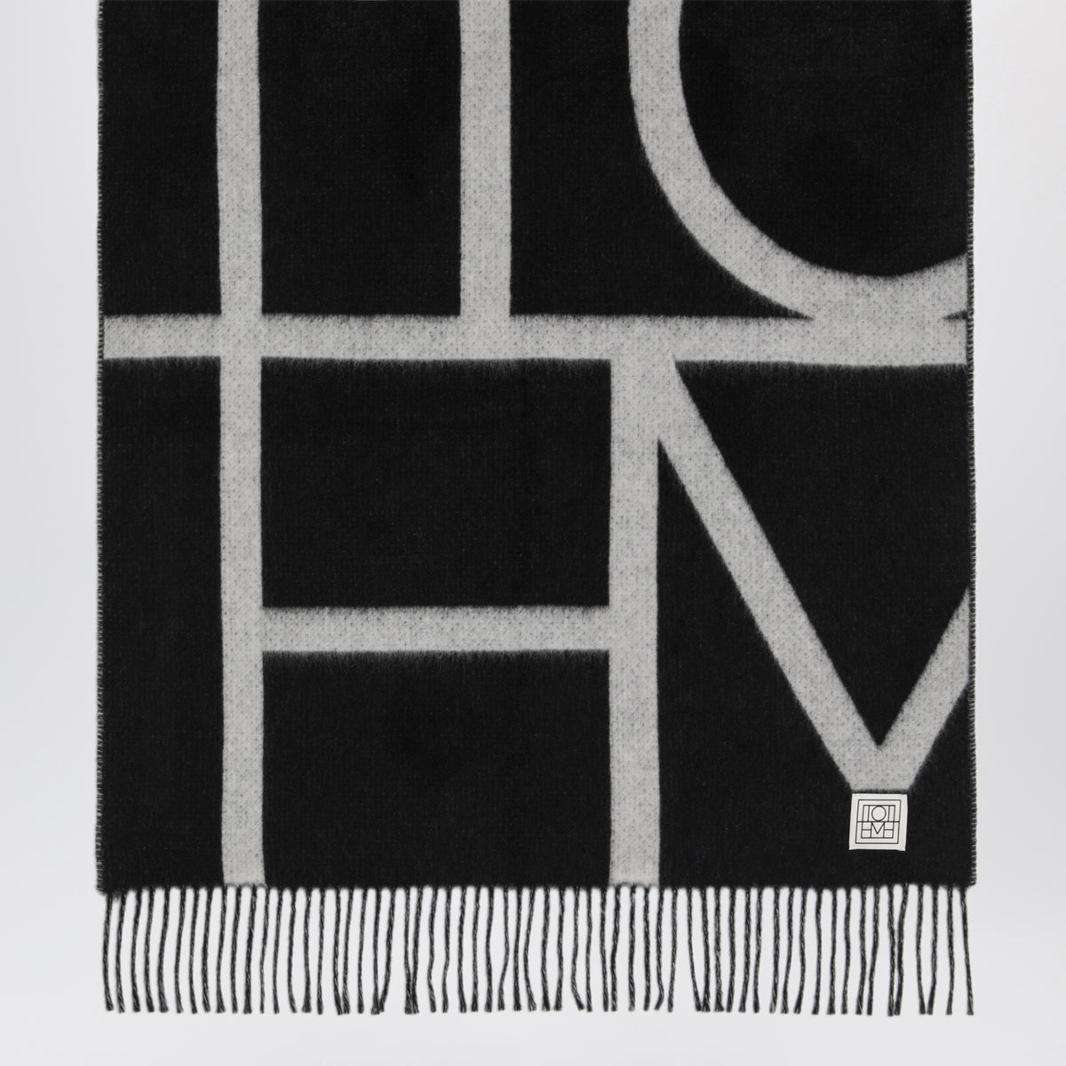 Sciarpa nera in lana spazzolata con monogramma