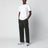 T-shirt bianca in cotone con patch logo