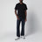 T-shirt nera in cotone con patch logo