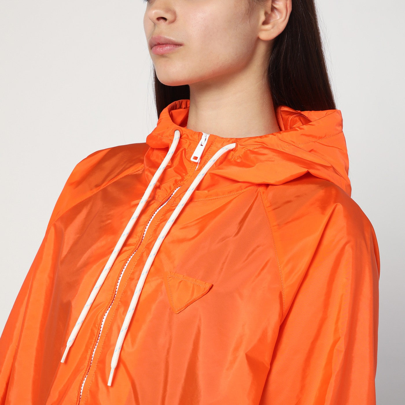 Orange raincoat in lightweight Re-Nylon