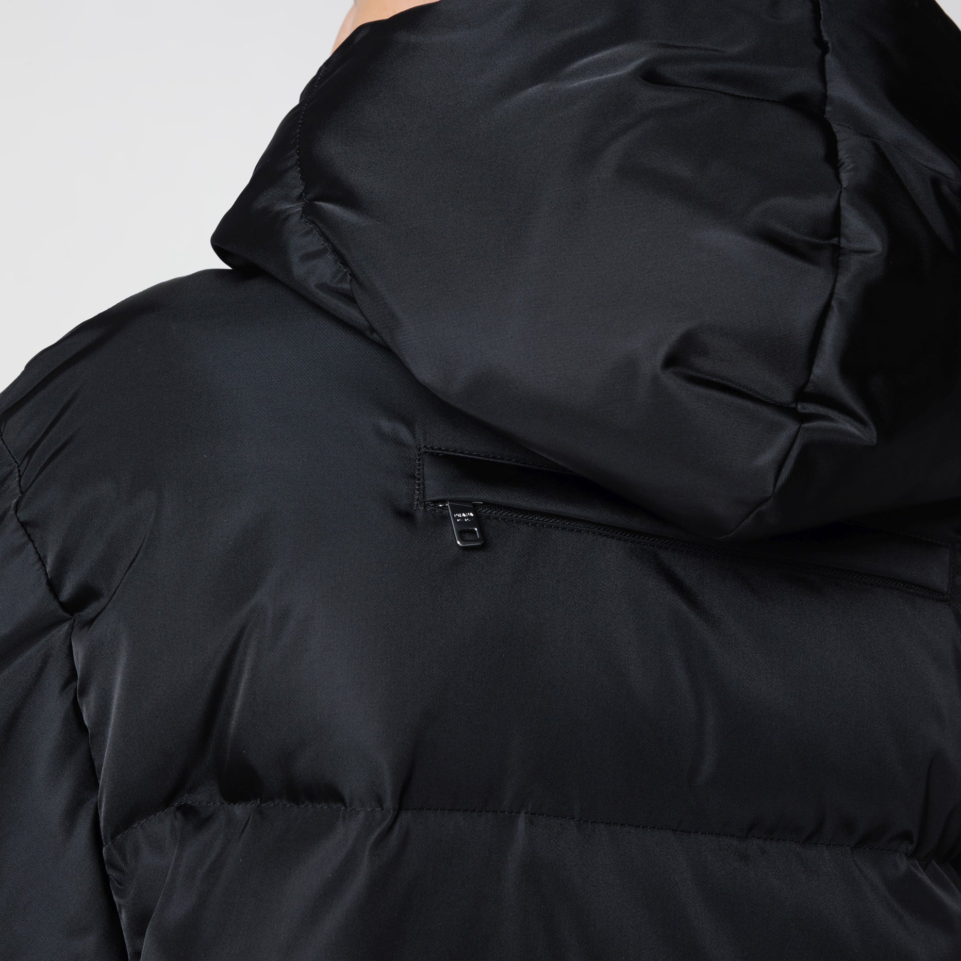Black zip-up puffer jacket in Re-Nylon
