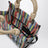 Small rainbow-striped mesh tote bag