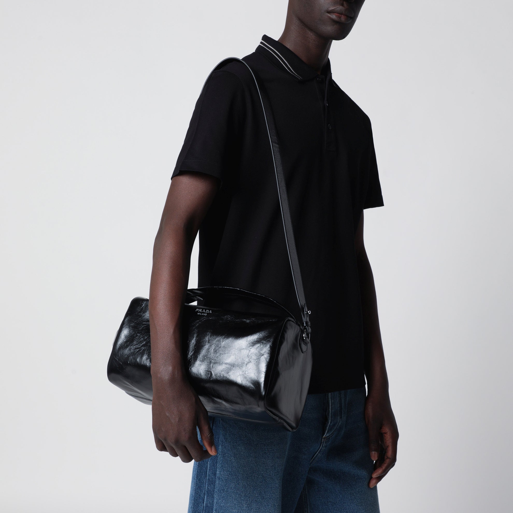 Black leather bag with glossy finish