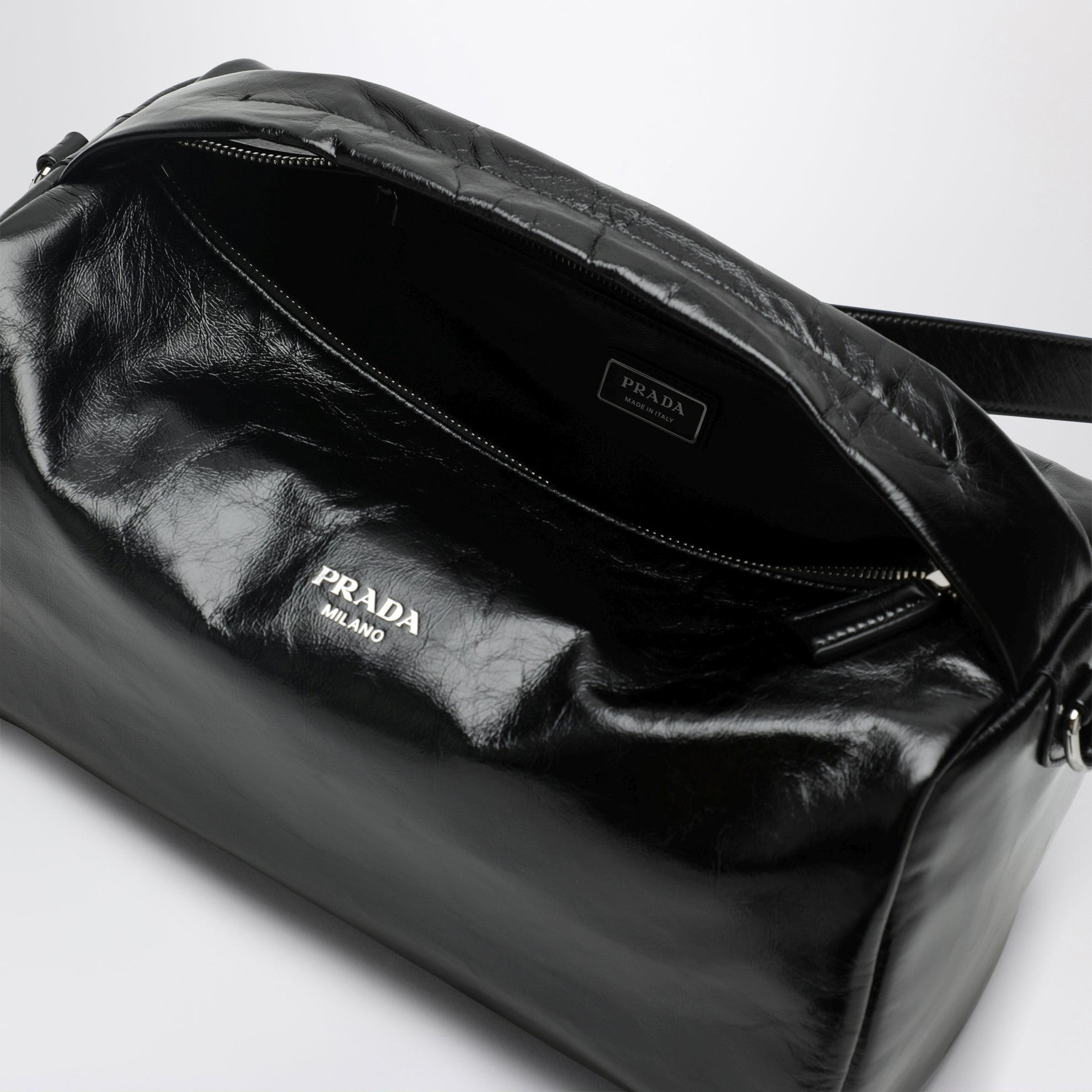 Black leather bag with glossy finish