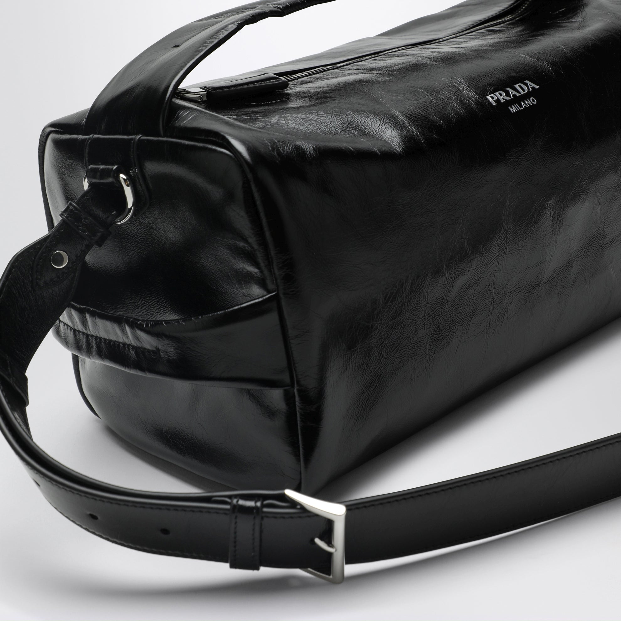 Black leather bag with glossy finish
