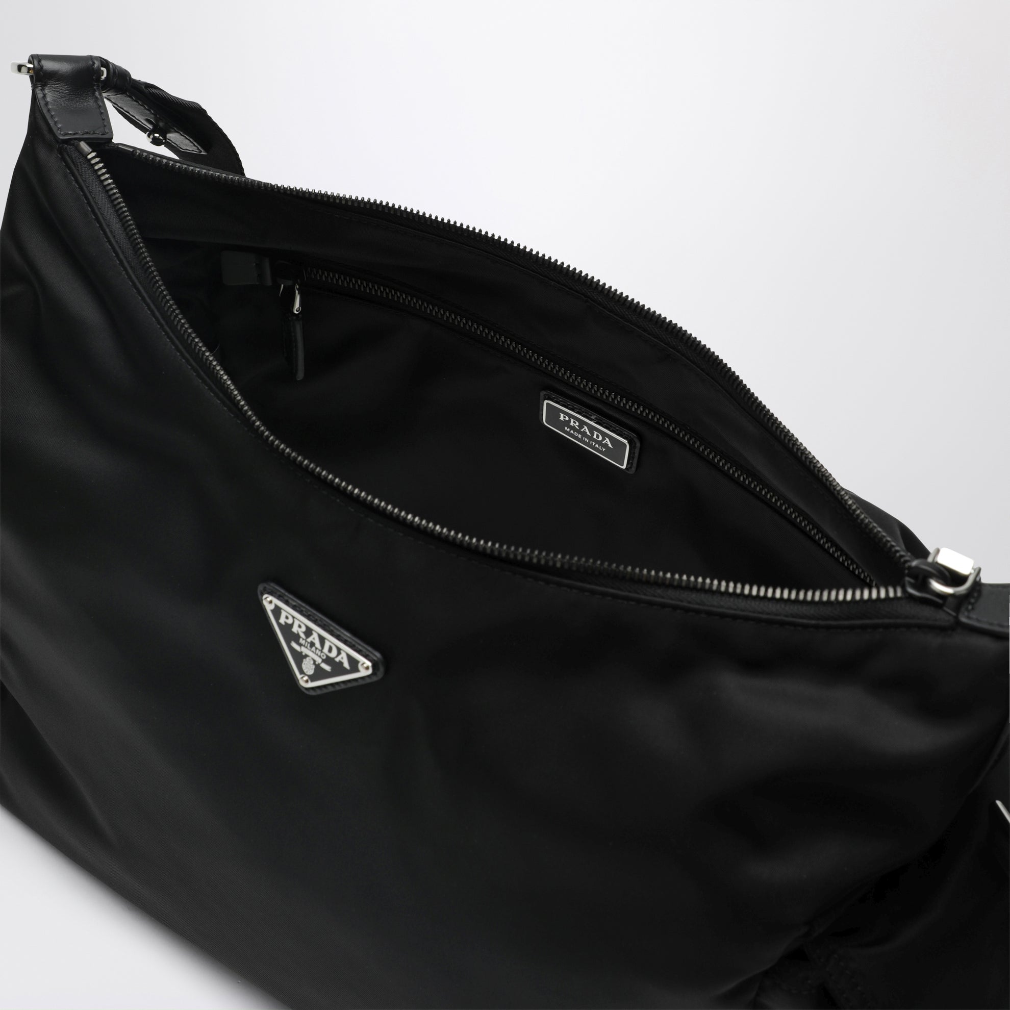 Black Prada Explore bag in Re-Nylon and leather by Prada