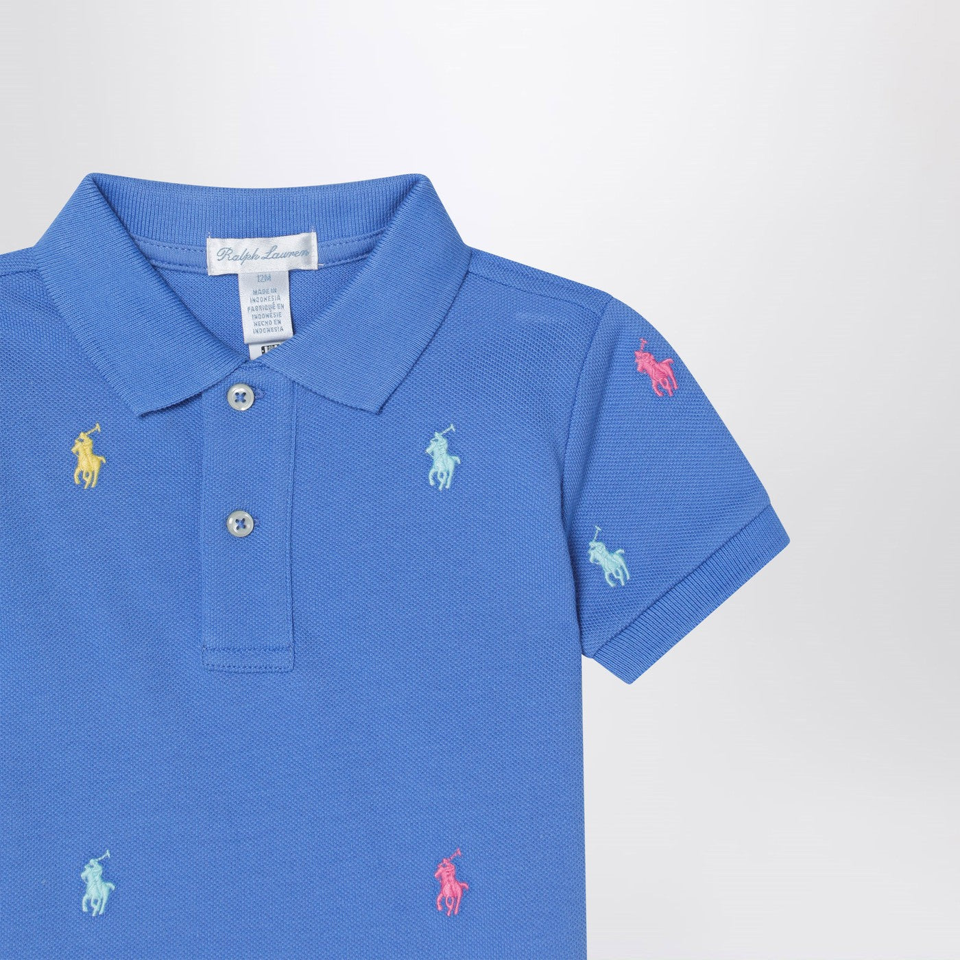 Light blue polo shirt with colourful logo embroidery