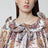 Blusa bianca Sea Garden con volant