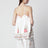 Top in misto lino con ricamo floreale