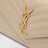 Pochette con catena Cassandre beige
