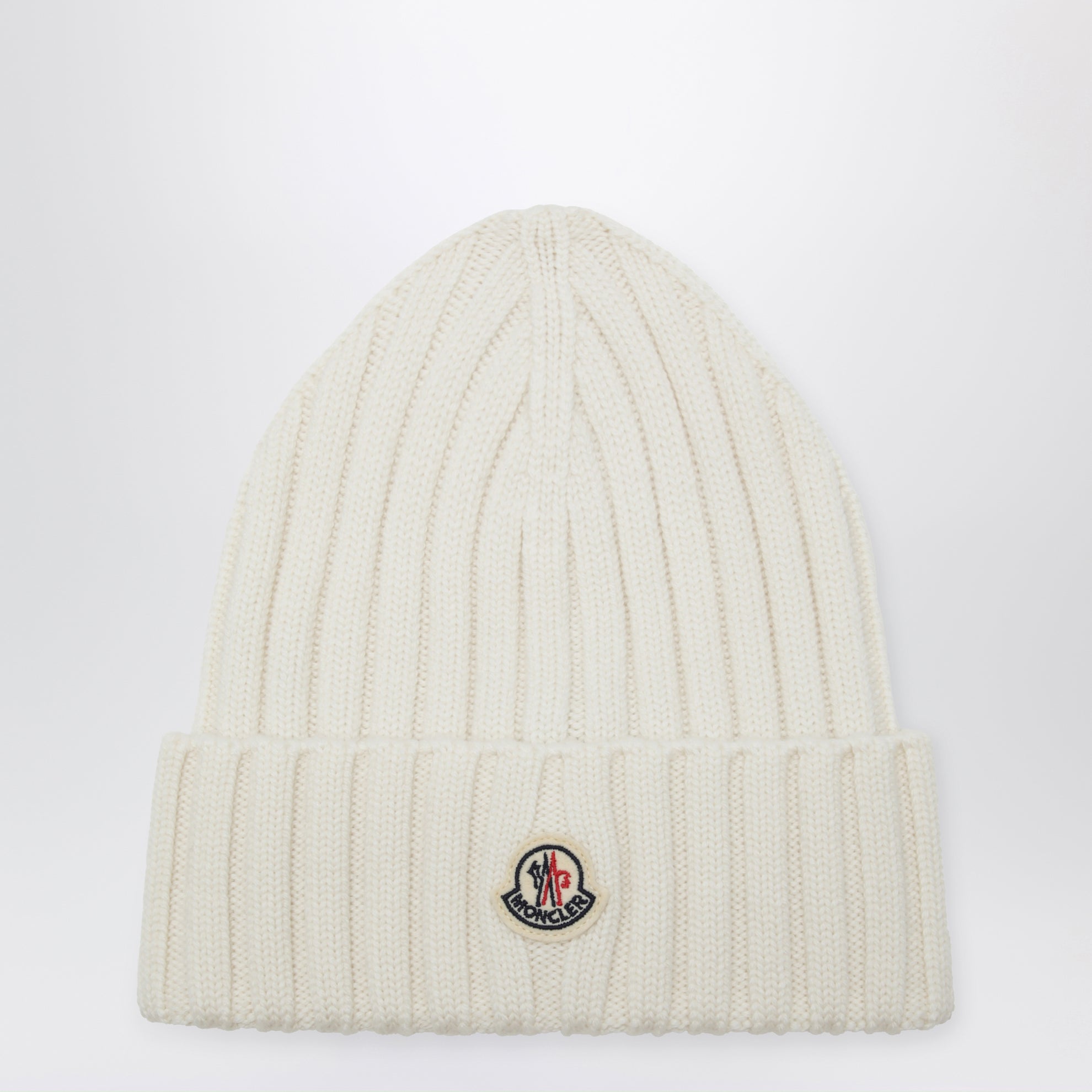 White cable-knit wool beanie with logo