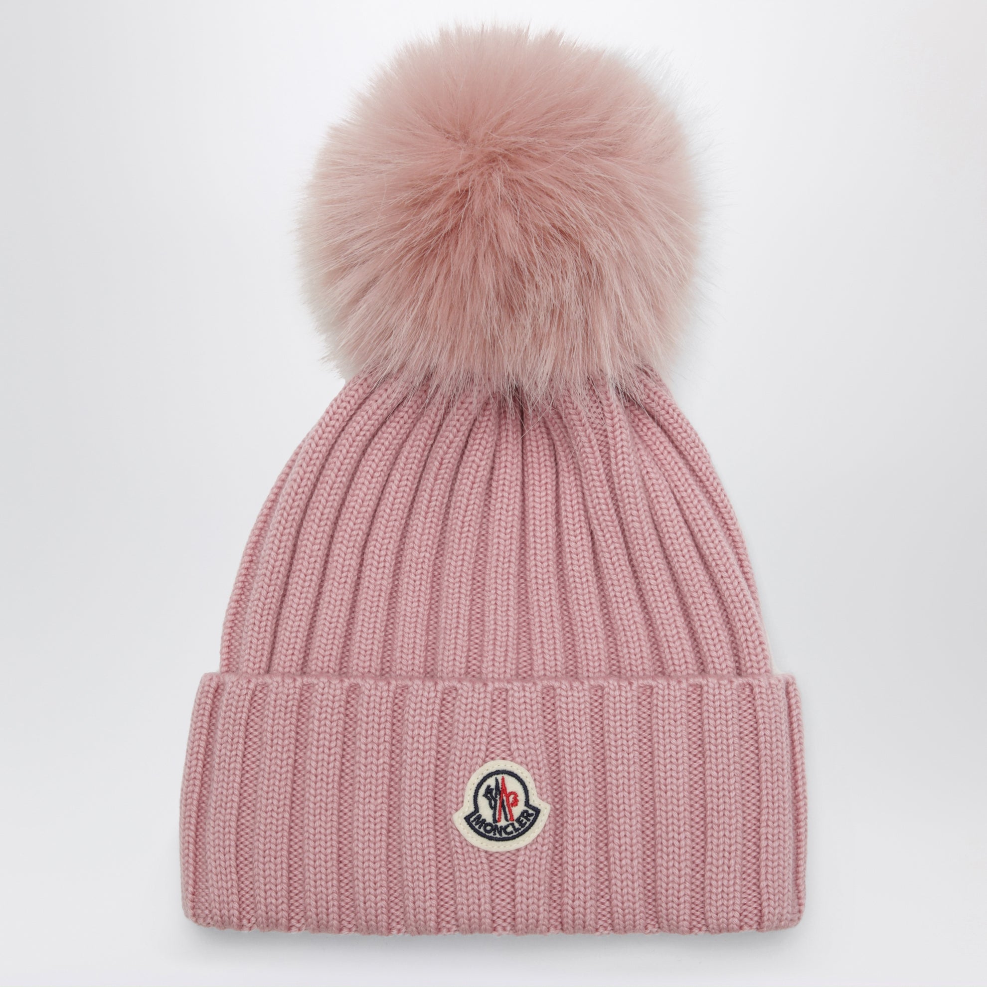 Bonnet rose en laine avec pompon