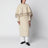 Cape coat with fringes in butter-coloured wool