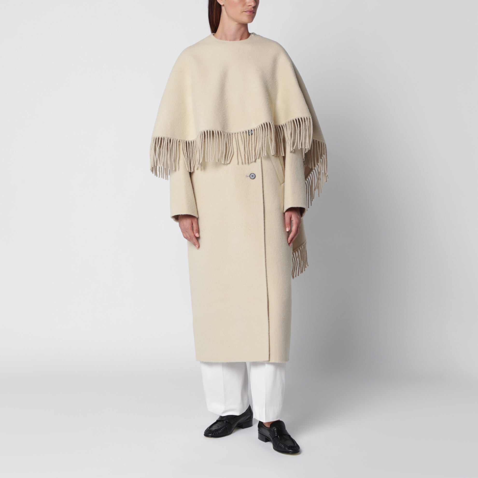 Cape coat with fringes in butter-coloured wool