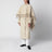 Cape coat with fringes in butter-coloured wool