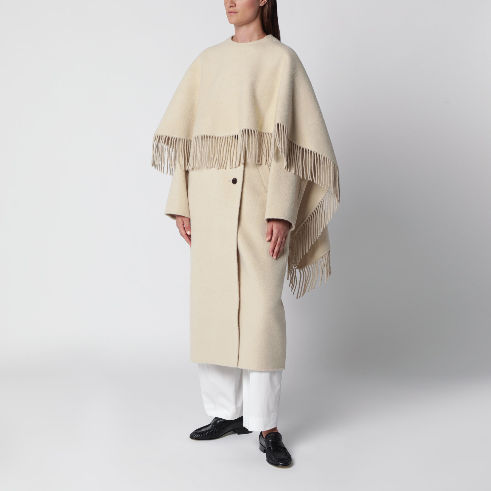 Cape coat with fringes in butter-coloured wool