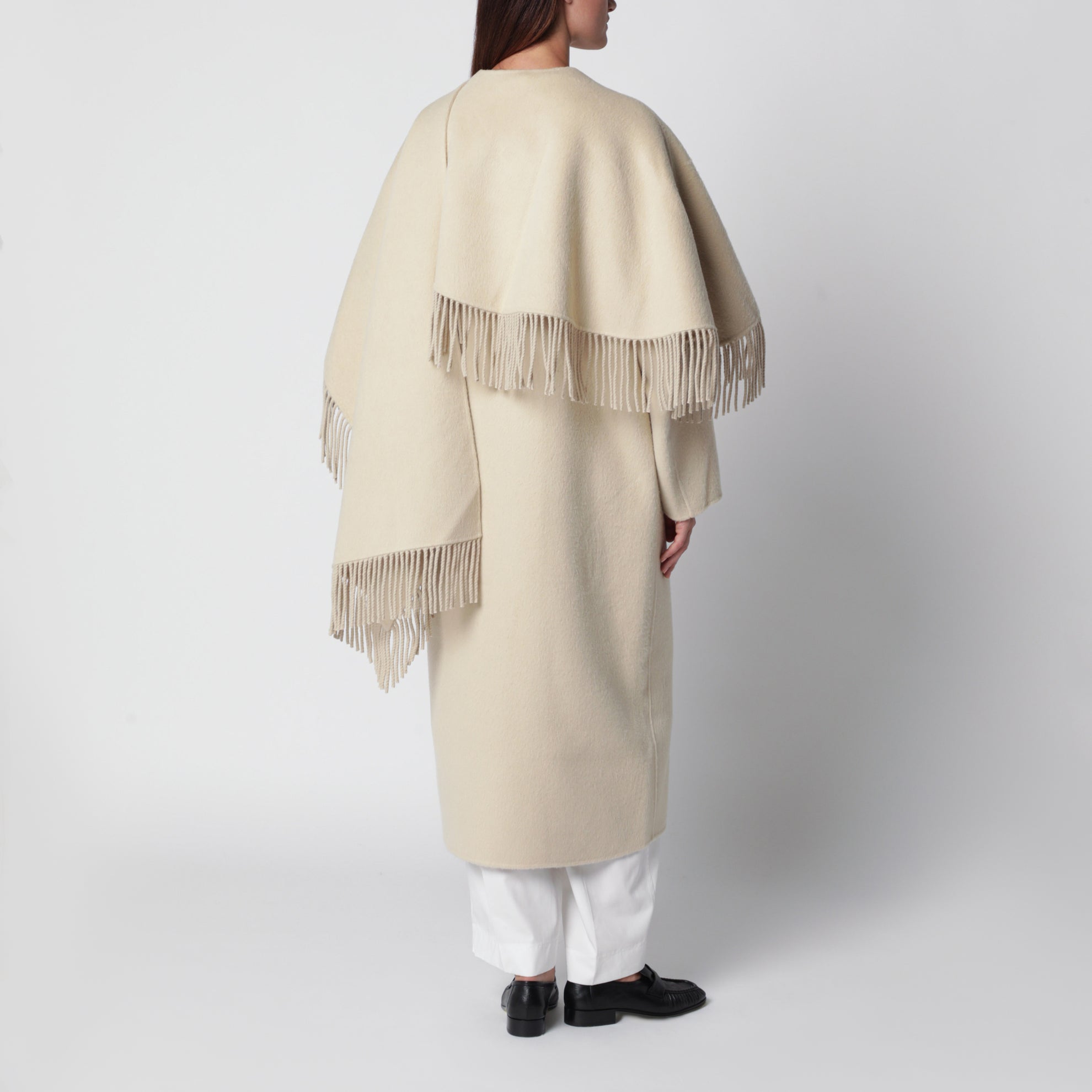 Cape coat with fringes in butter-coloured wool