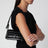 Black Hazel bag in croc-effect patent leather