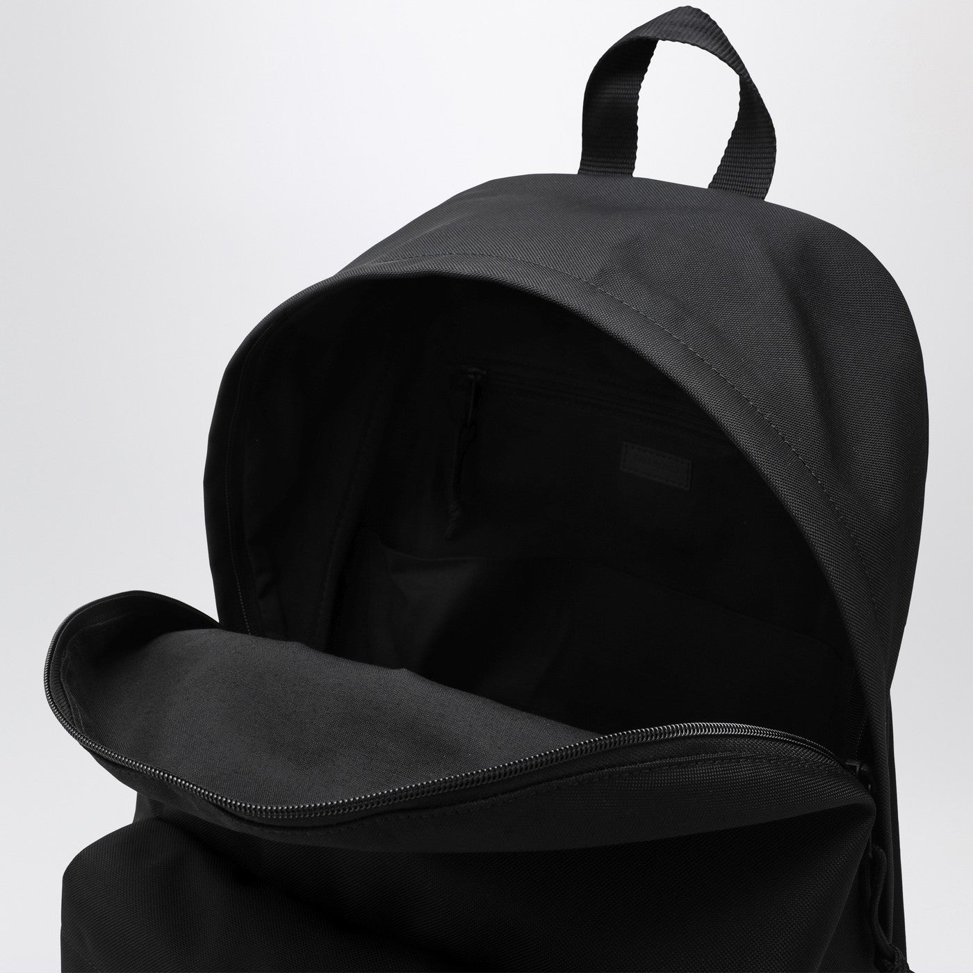 Black Explorer backpack with logo patch