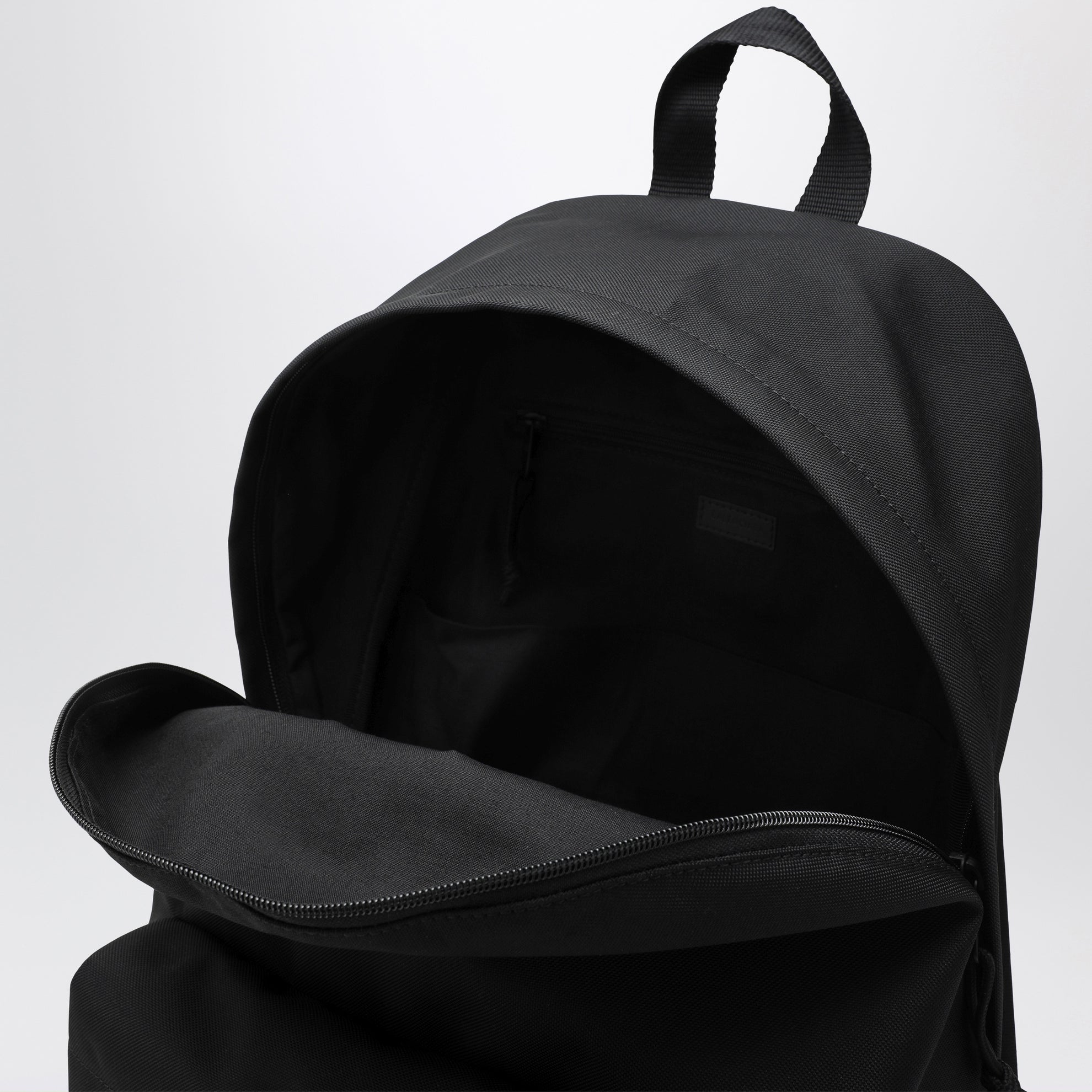 Black Explorer backpack with logo patch
