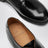 Schwarze Derby-Schuhe aus Leder