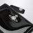 Black Slim Flap Card Holder with crystal-embellished Orb Bas Relief