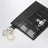 Porte-cartes à breloques en cuir noir effet croco