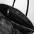 Borsa a mano in pelle lucida nera