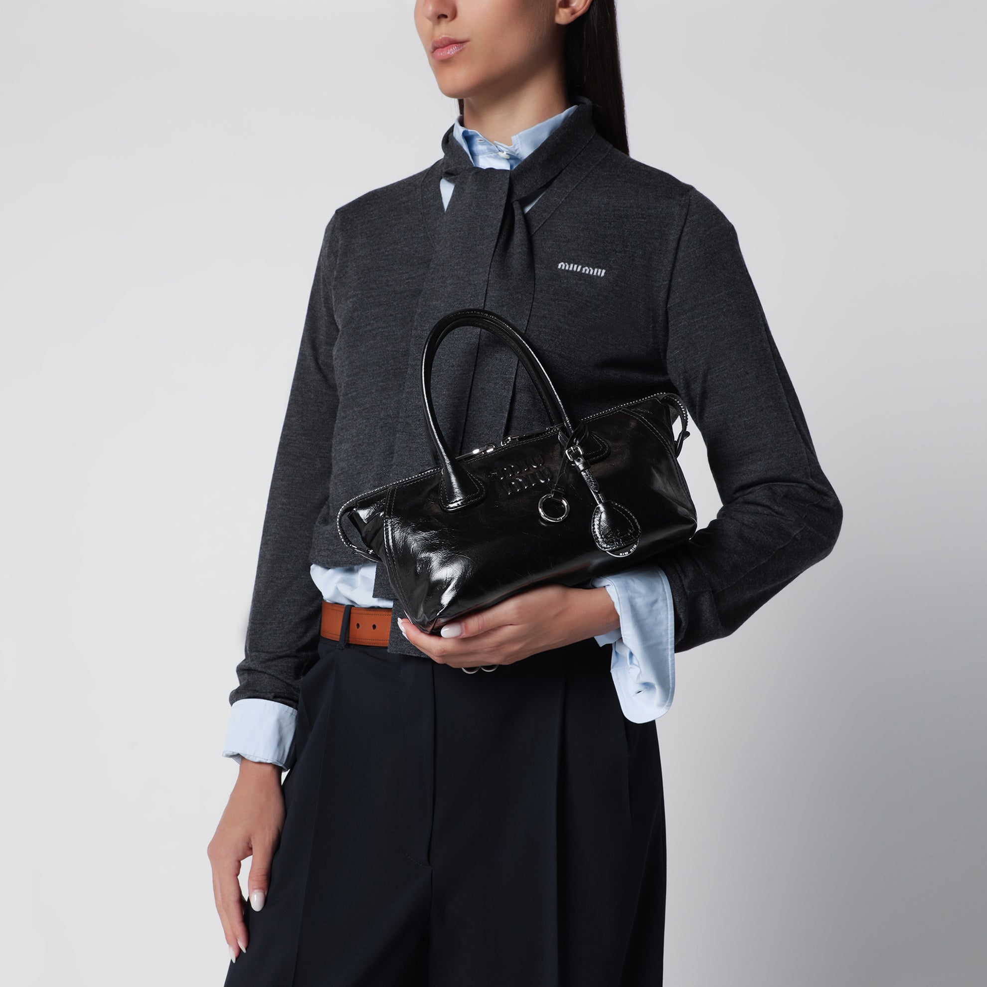 Black glossy leather top-handle bag