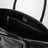 Black glossy leather top-handle bag